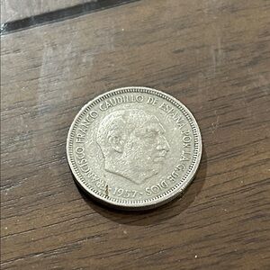 1957 Spanish 5 pesetas coin featuring Francisco Franco. 
Collectors